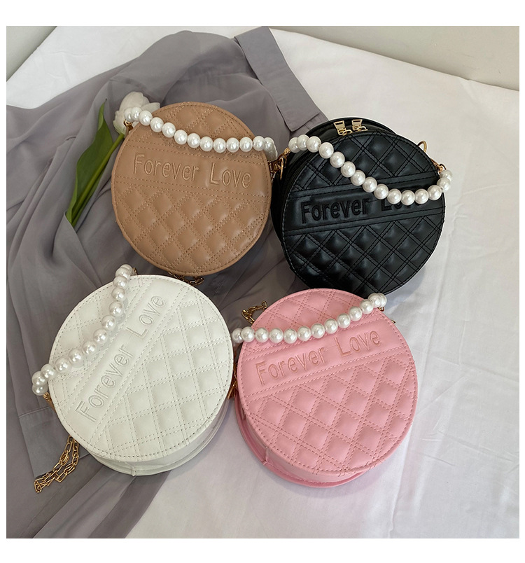 Fashion Solid Color Embossed Pearl Handle Small Round Bag display picture 2