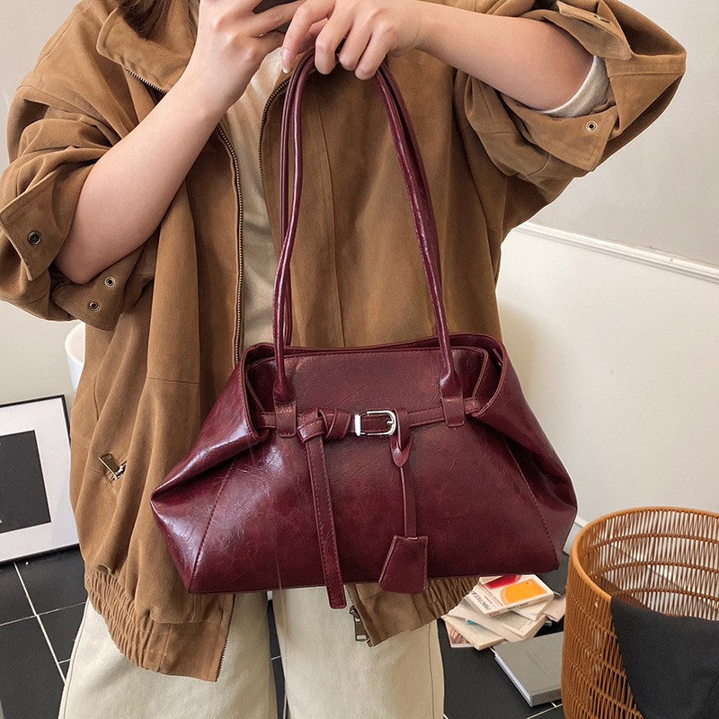 Alta textura retro gran capacidad hombro brazo bolso de mujer 2025 nuevo otoño invierno universal bolso de mano de viaje