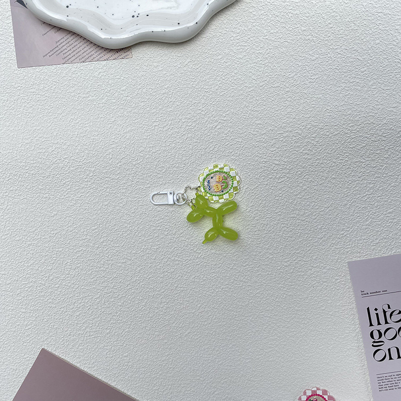 Pequeño Libro Rojo mismo lindo jalea globo láser perro llavero colgante colorido cachorro de dibujos animados teléfono llavero