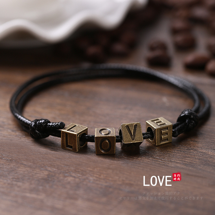 Pulsera tejida a mano – motivos trébole/póker, estilo unisex vintage