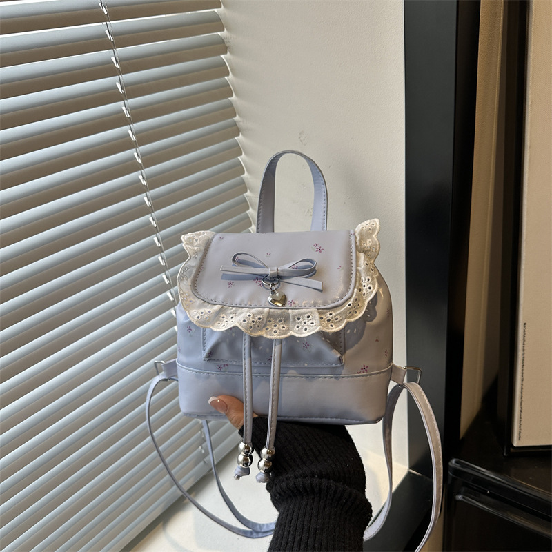 Mochila de flores para mujeres 2026 nueva moda alta sensación de mochila de estilo universitario ultra caliente de moda versátil mochila de viaje