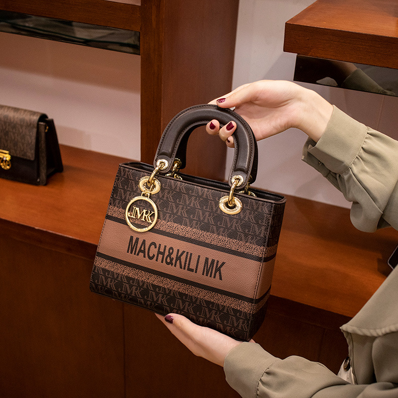 Hong Kong marcas de alta marcas de cuero real Diana bolsa para mujeres 2023 nueva moda alta sensación de hombro grande bolso de mano de mujer