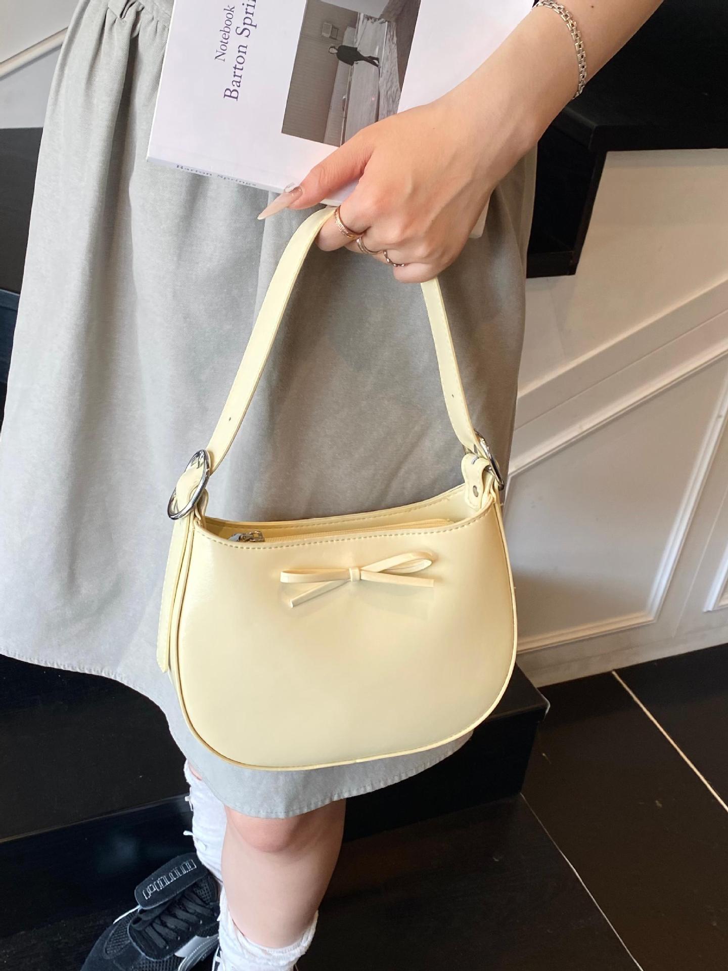 Nicho coreano de lujo ligero arco brazo bolso para mujeres 2025 nuevo estilo versátil bolso de hombro de estilo extranjero bolso de moda