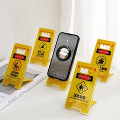 アルバイトの人の創意アクリル携帯スタンドのデスクトップ携帯で劇を追いかけて支えています。