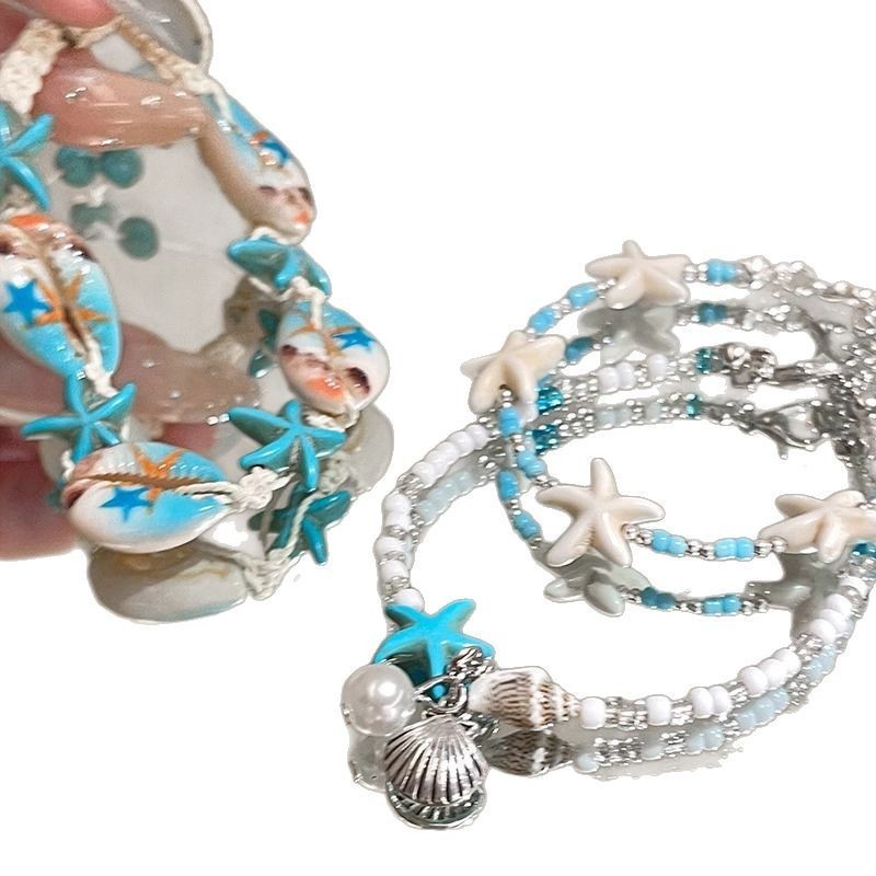 Braccialetto di perline di riso fresco ed elegante con conchiglia di stella marina in stile naturale per le vacanze al mare_voghion.com