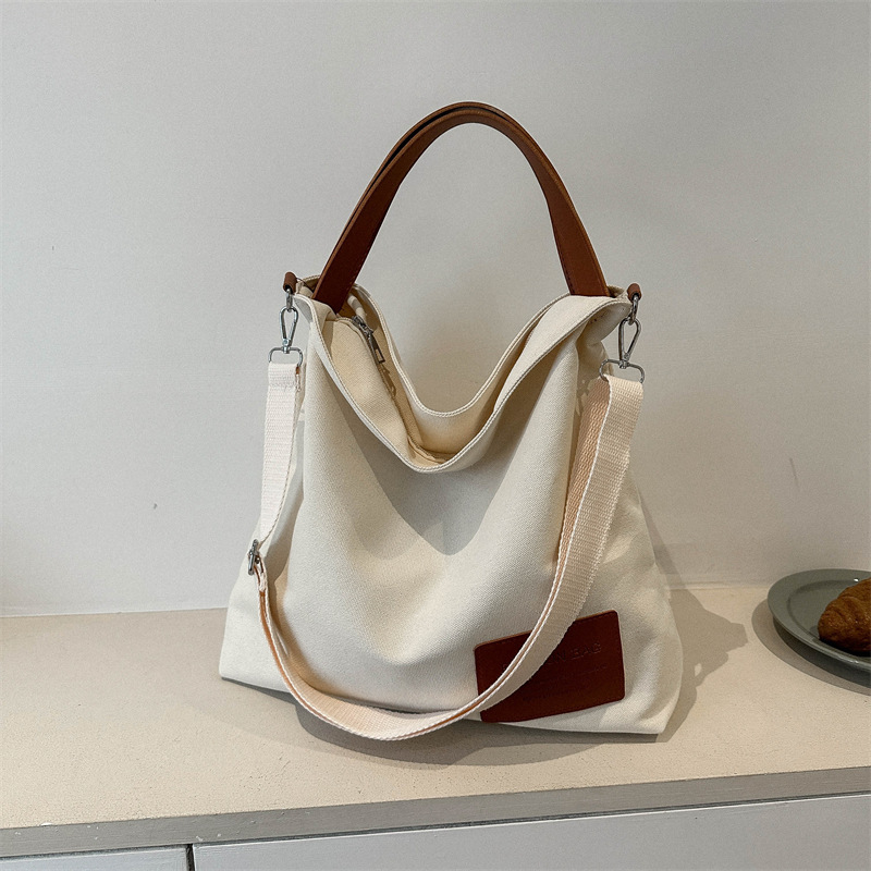 Canvas Bag Women's Large Capacity Niche Design Popular Texturing Handbag Commuter College Students Class Crossover Trendy Bag Canvas Bag Women's Large Capacity Niche Design Popular Texturing Handbag Commuter College Students Class Crossover Trendy Bag