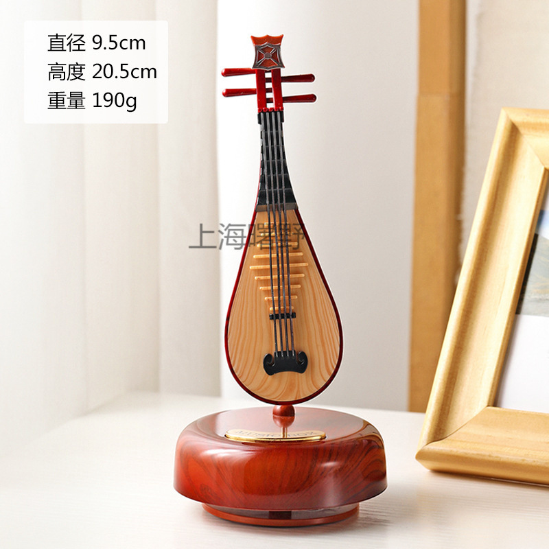 Classic rotating guitar, violin, table music box