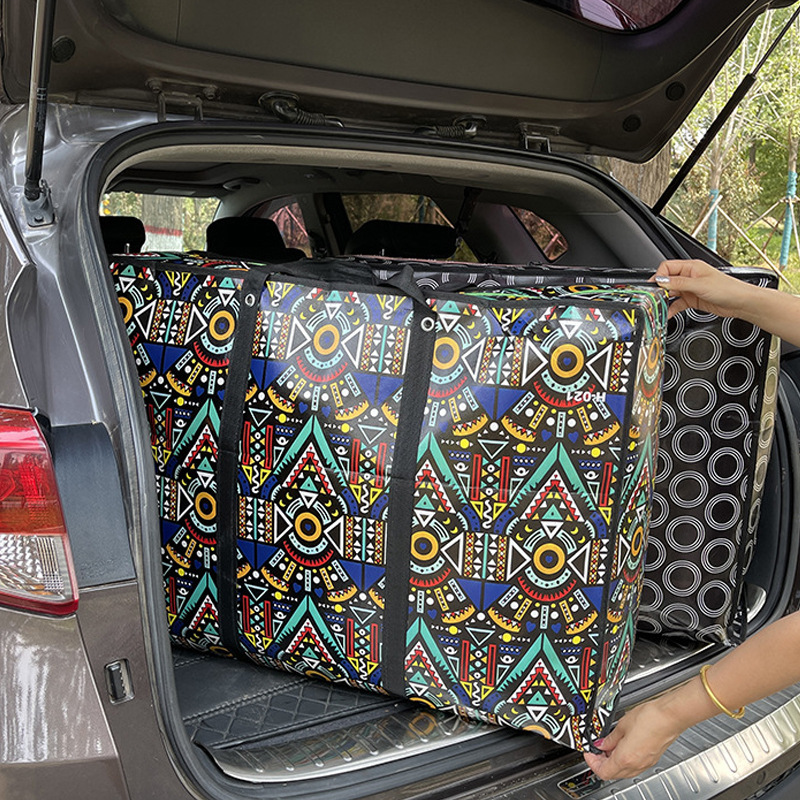 Envío gratuito no tejido recubierto impermeable bolsa móvil de gran capacidad de moda bolsa de equipaje de mano bolsa de almacenamiento de edredón al por mayor
