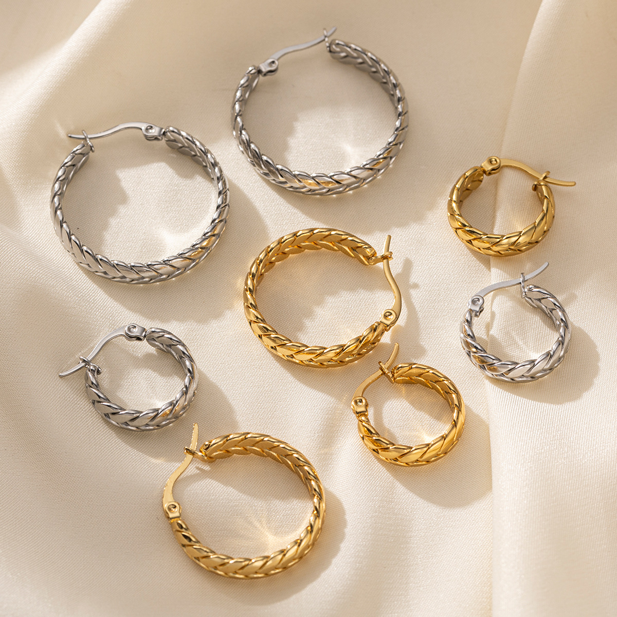 TENA europa y americana pendientes de acero inoxidable temperamento de alta calidad trenzado galvanizado de oro de titanio de 18k inserciones de joyería transfronteriza