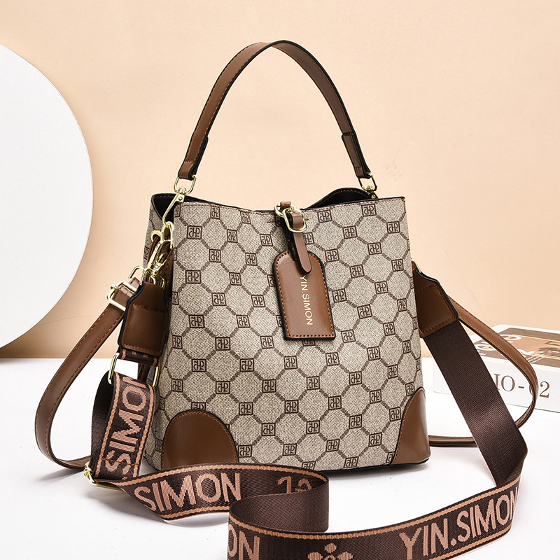 Bolsos bolsos de mujer bolsos de moda retro 2025 bolsos de nuevo estilo de gran capacidad y sentido de alta calidad bolso de cubo diagonal de un solo hombro mujeres