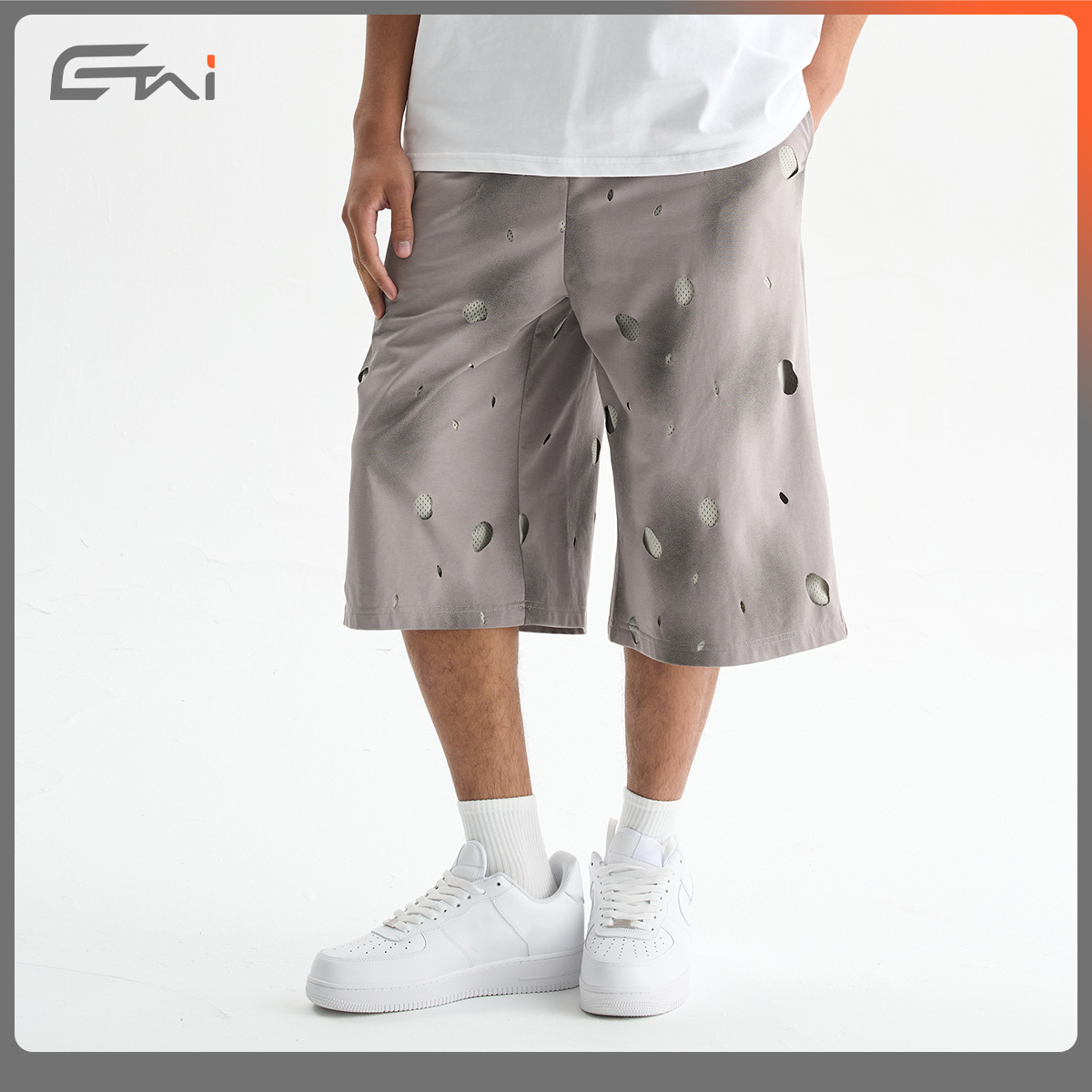 ETAI Hombre| Alta calidad falsa dos piezas agujeros viejos pantalones de rodilla de malla suelta transpirables pantalones cortos de hombre de doble capa