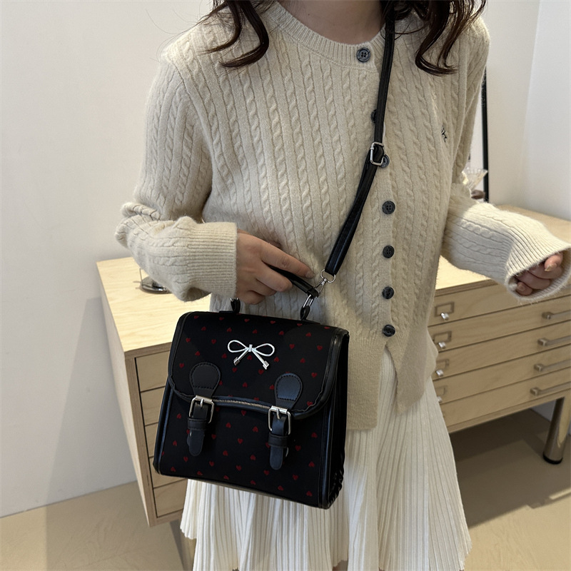 Bolsas casuales populares de este año para mujeres 2024 nueva moda vertical estilo de moda universal doble arco mochila