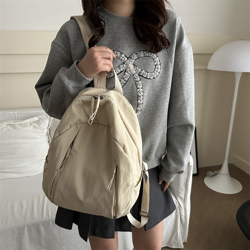 Mochila de clase universitaria casual nicho de diseño de color sólido 2025 nueva gran capacidad de viaje de viaje de viaje de la moda