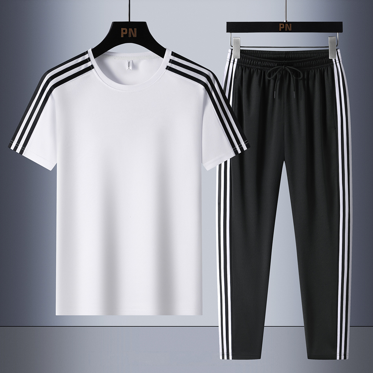 Set de tres barras de verano de moda para hombres, mangas cortas transpirables, pantalones casuales rectos para hombres, set de dos piezas.
