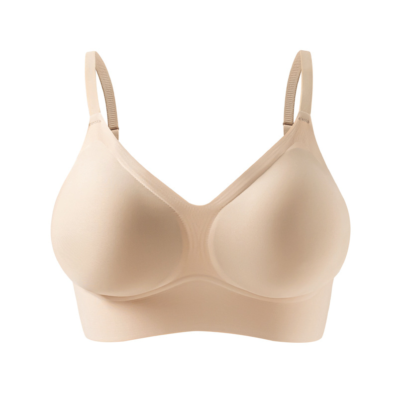 Expansión de la ropa interior invisible de la mujer pecho pequeño se reúne para mostrar una taza vacía sin marca fondo líquido sostén blanco T no es permeable