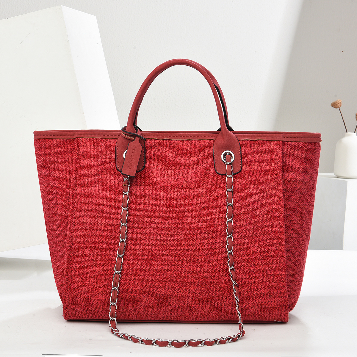 Bolso de mano de gran capacidad 2025 textura elegante bolso de mujer de color puro bolso de cubo con cadena bolsos transfronterizos