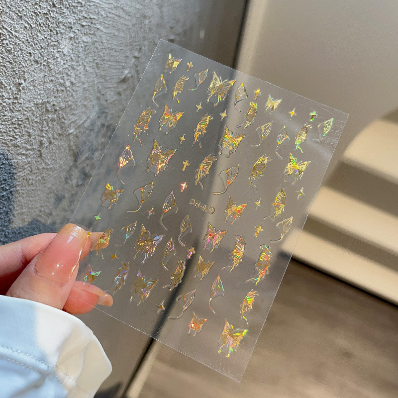 液体の蝶のネイルシールの立体レーザーと金銀の白黒の蝶の薄い靭性帯のゴムを背負って花の爪を貼って卸売りを貼ります。|undefined