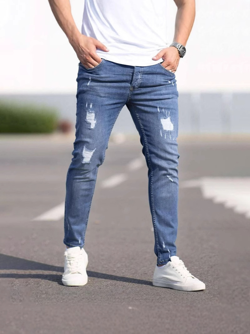 Vaqueros ajustados para jóvenes estadounidenses, pantalones de pie de tendencia para hombres, venta caliente transfronteriza, jeans ajustados rasgados de Amazon