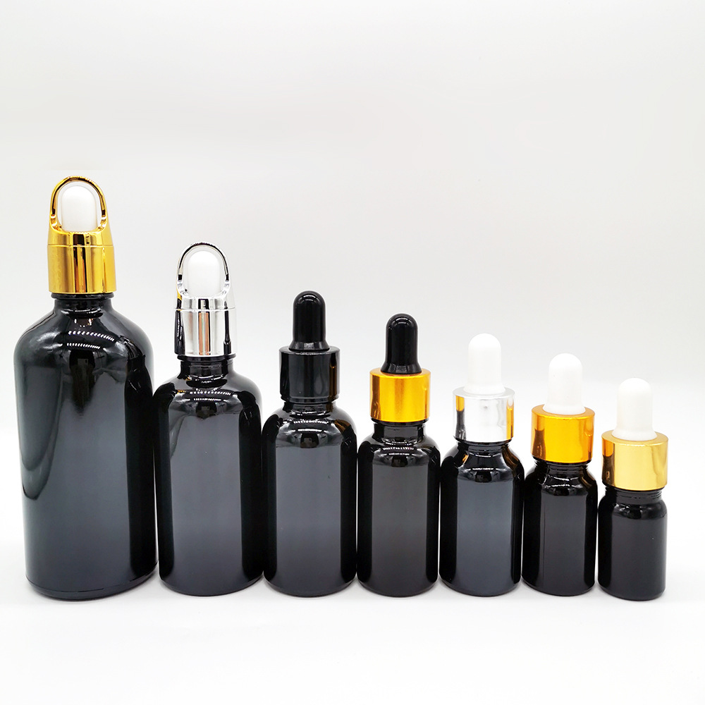 En stock botella de aceite esencial de vidrio negro brillante 5mL-100mL materia prima cosméticos negros sub-botella sombreado botella cuentagotas de cabeza de goma