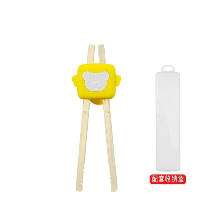 노란색 상자에 곰 조절 젓가락