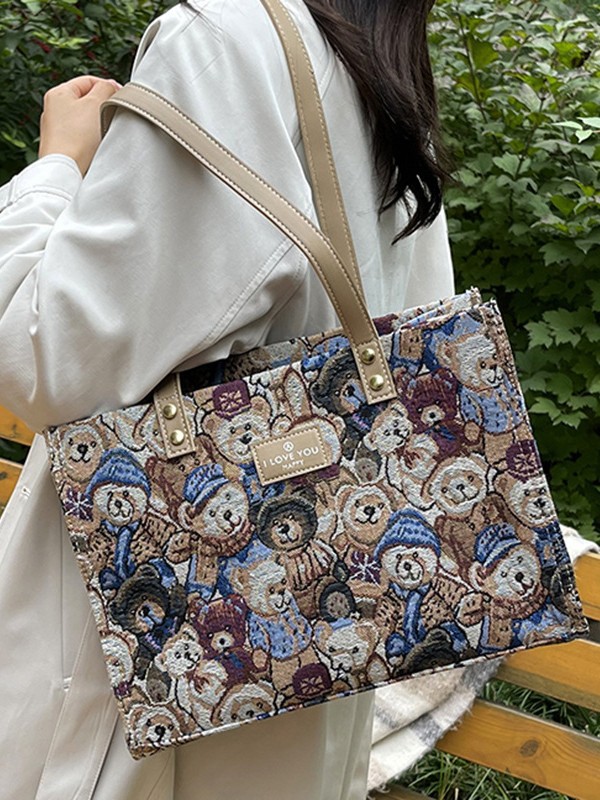 Bolsa de lona impresa de dibujos animados para mujeres 2024 nueva bolsa de gran capacidad, bolsa de hombro de viaje casual versátil