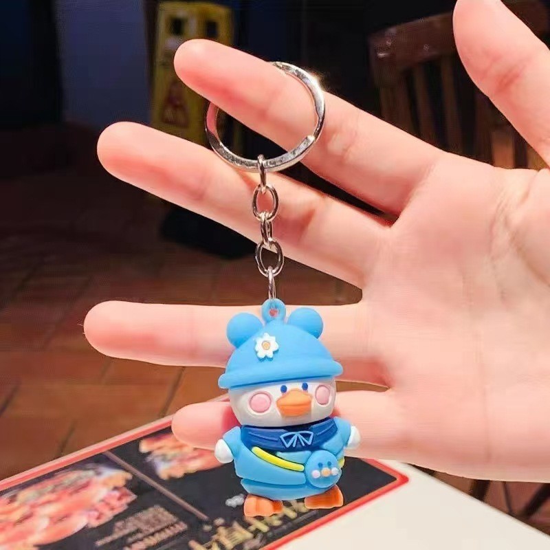 Muñeca de dibujos animados goteo llavero bolsas escolares exquisitas para hombres y mujeres colgantes para agarrar muñecas colgantes para el mercado nocturno regalos al por mayor