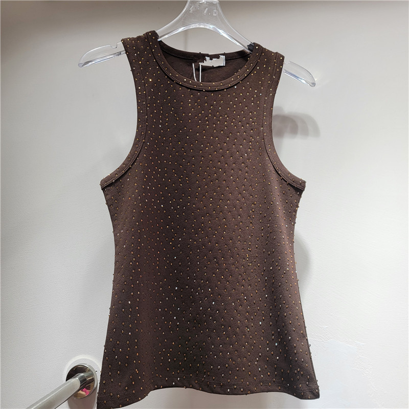 El nuevo diamante caliente de la industria pesada en el verano de 2025 está lleno de estrellas del cielo, diseño de nicho, chalecos cortos, tirantes y blusas para mujeres de fondo.