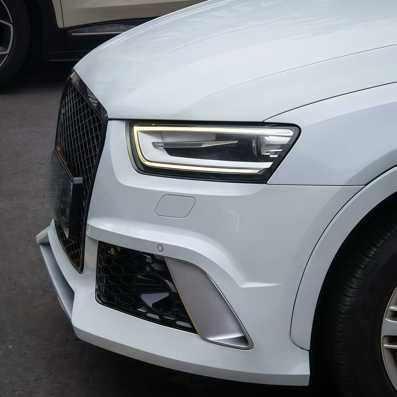 Suitable for Audi Q3 models from 2012-2015, this is an RS Q3-style front bumper, front grille, and front fascia kit