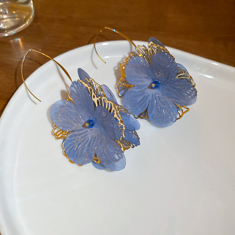 Pendientes de flores de moda coreana de nuevo estilo femenino fresco niña vacaciones viento gancho de oreja temperamento femenino pendientes de nicho de alto nivel