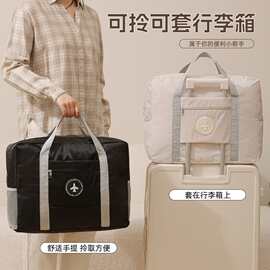 跨境飞机旅行包纯色大手提圆标拉杆包折叠旅行包衣物收纳袋便携袋