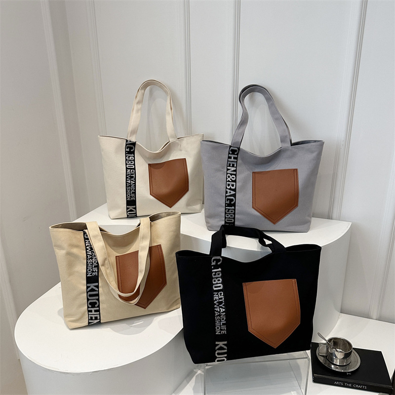 Bolso de mujer 2024 invierno nuevo bolso de gran capacidad de transporte de lona bolso de brazo de moda simple bolso de hombro