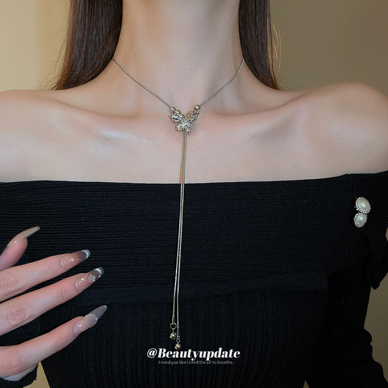 Serie de plata Collar de borla de cuentas de mariposa ajustable Cadena de clavícula de moda exquisita Cadena de suéter de diseño de lujo ligero Mujer