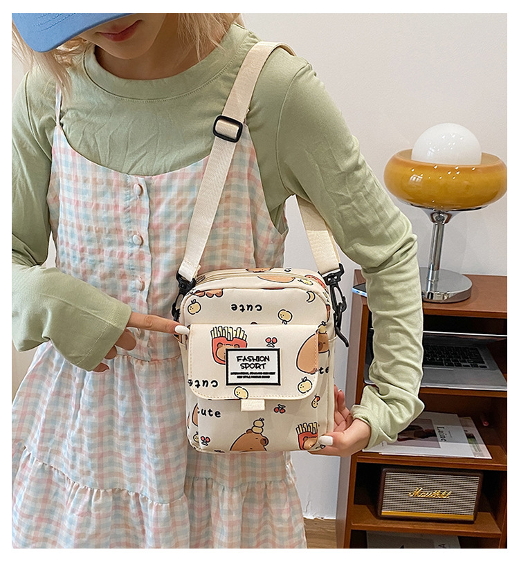 Cartoon animal print, many pockets, few bags, single-shoulder bag for girls, large capacity, cute graffiti, lightweight schoolbag for primary and middle school students full figure