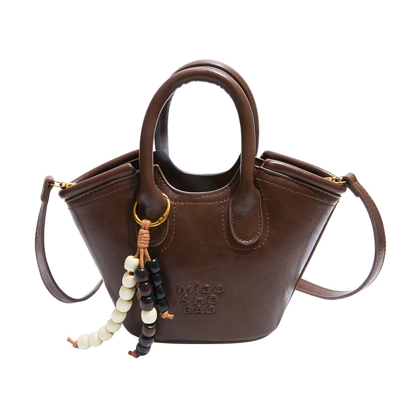 Bolsa de aire coreana para mujeres 2025, otoño y invierno, nuevo estilo de alta calidad, bolso de cubo portátil, bolso de hombro para viajar.