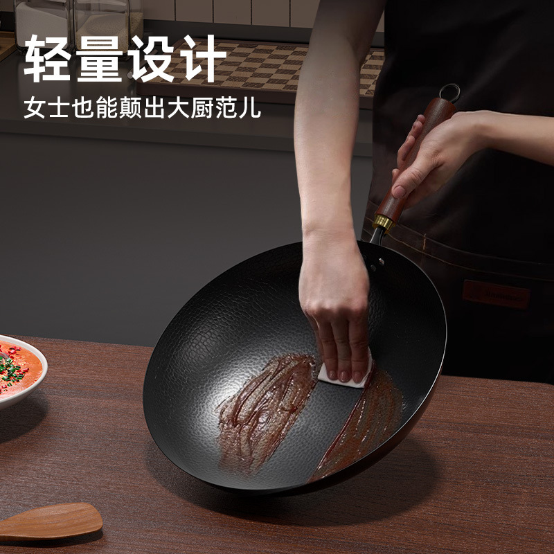 Nuevo tipo de olla de hierro tradicional forjada a mano sin recubrimiento antiadherente olla de horno general olla de hortalizas casera olla de frita