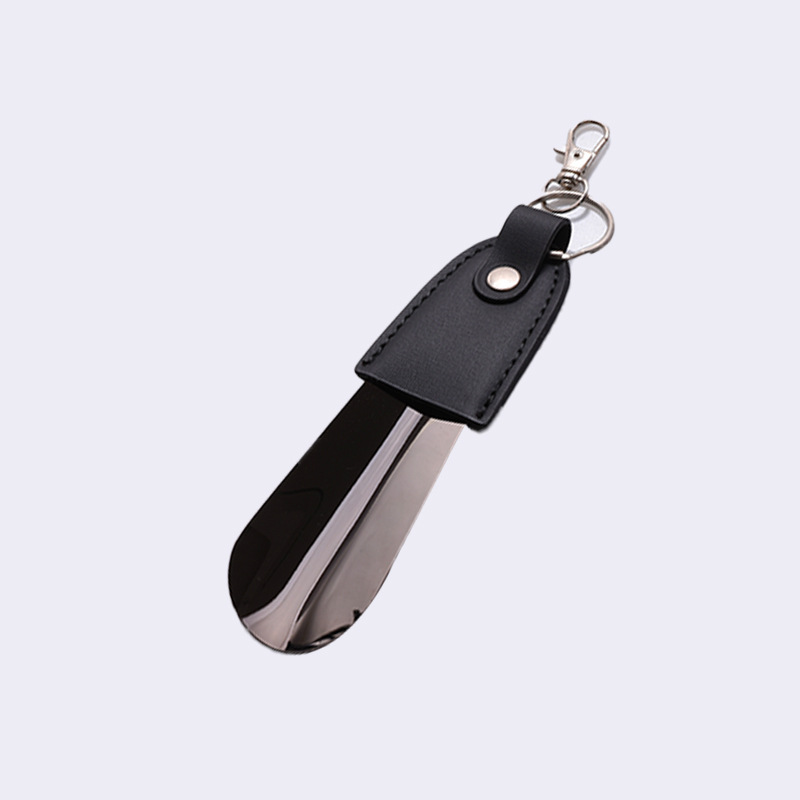 En stock suministro de acero inoxidable hebilla de llave tirador de zapatos con cubierta de cuero tirador de zapatos llave del coche colgante fácil de llevar levantador de zapatos
