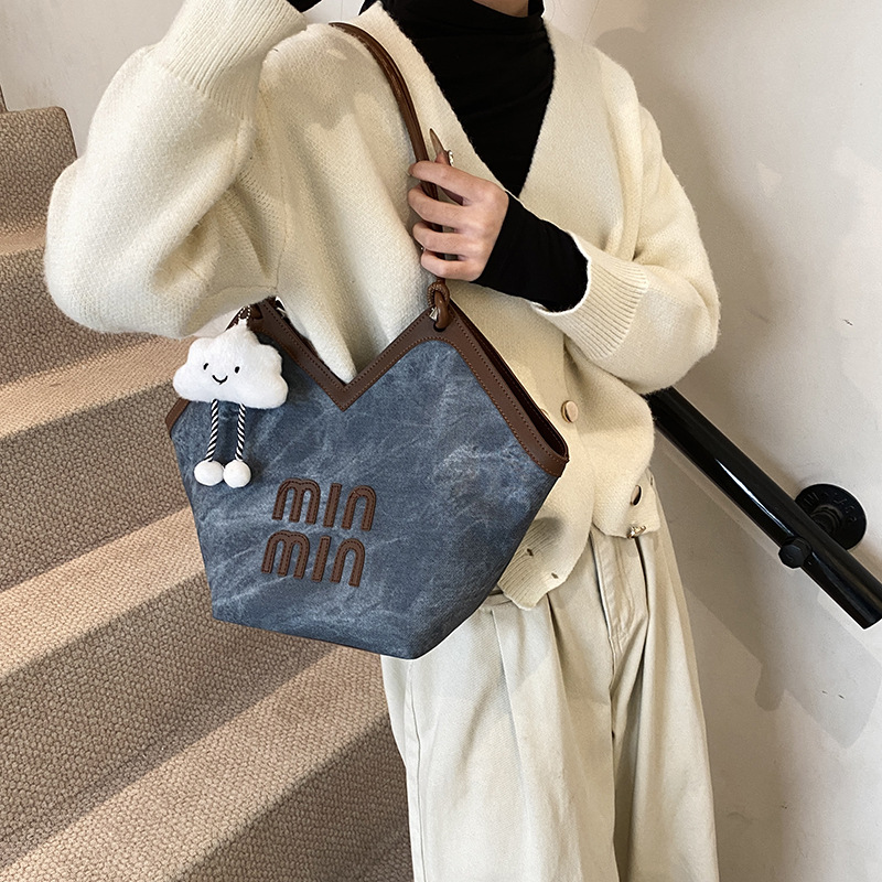 2024 nueva bolsa de gran capacidad para mujeres, bolso de hombro Sen Meng, bolso de diseño de nicho, bolso de viaje de alta calidad para mujeres