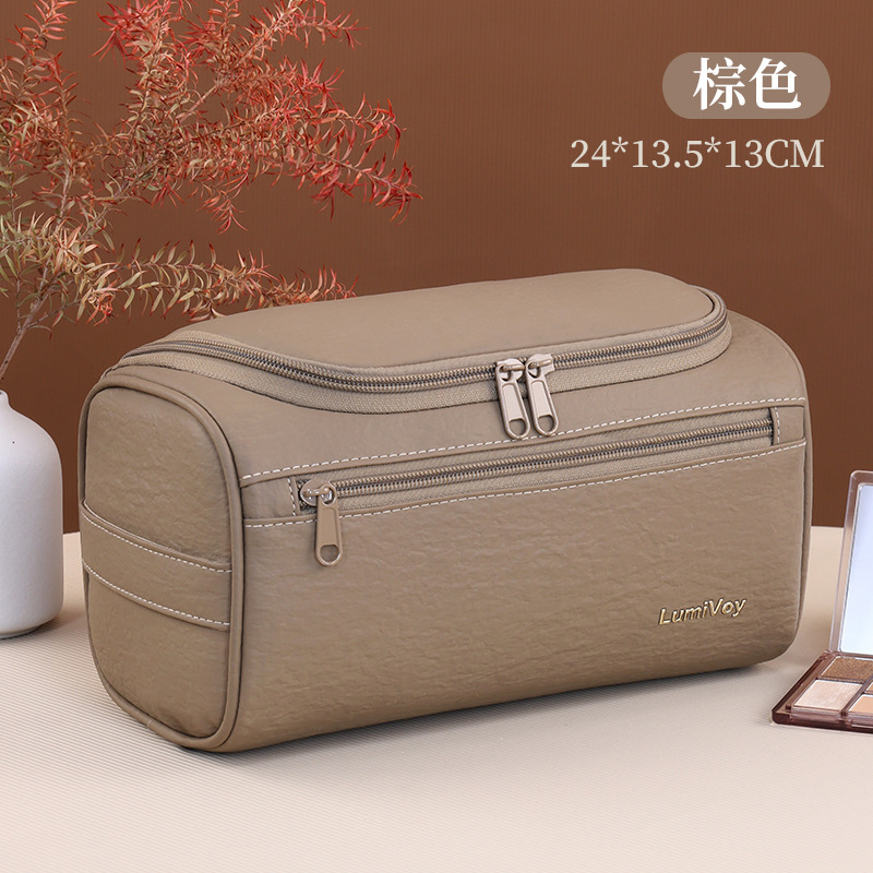 Bolsa de cosméticos portátil transfronteriza, estilo europeo y americano, gran capacidad, almacenamiento impermeable, bolsa de aseo de cuero PU para viaje, bolsa de almacenamiento multifuncional.