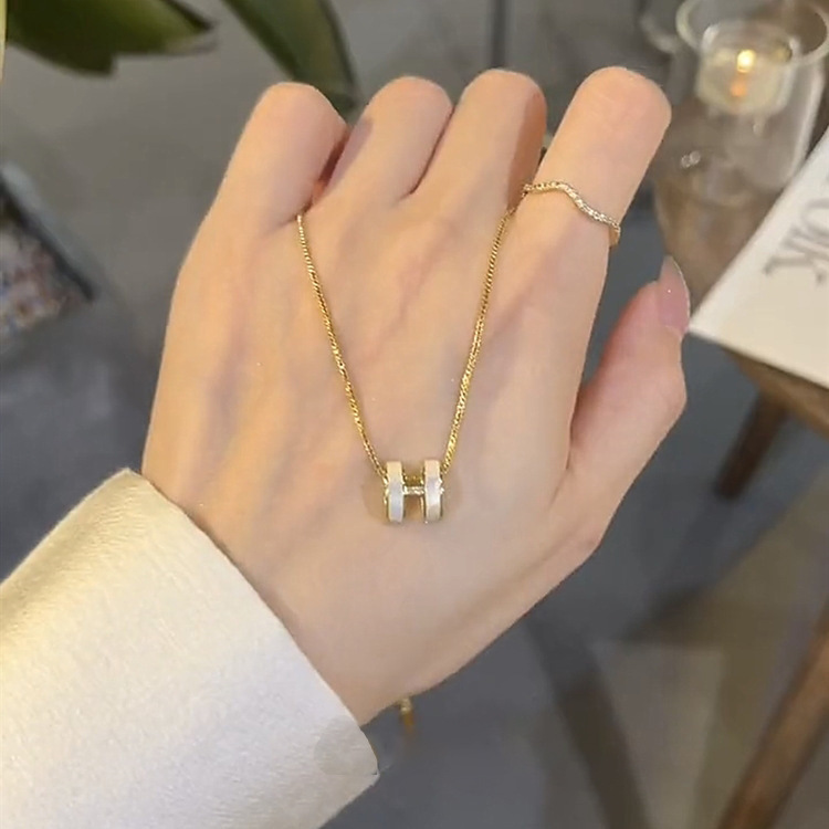 Necklace with zircon with letters