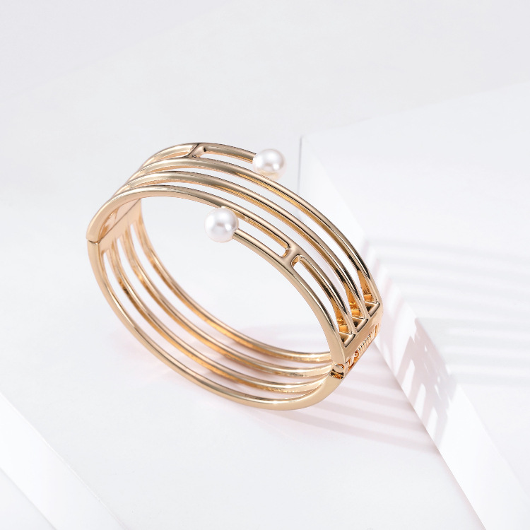 simple multi-layer hollow line-shaped double-headed pearl gold bracelet