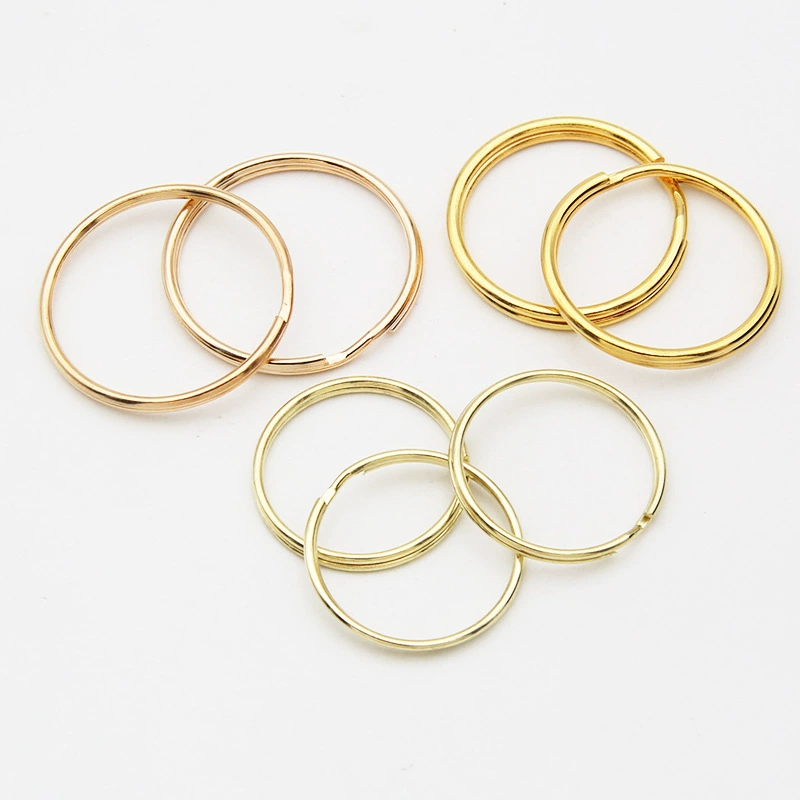 Оптовые поставки: гальванизированные золотом брелоки различных размеров, двухслойные металлические брелоки с двойным кольцом для самостоятельного изготовления, аксессуары для ключей.