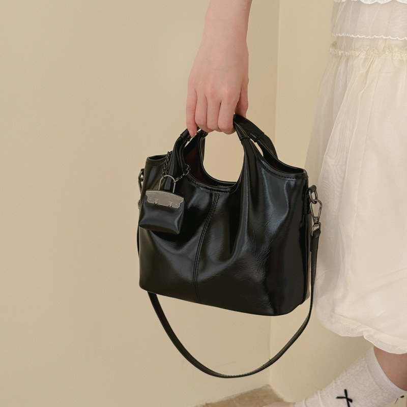 Nuevo balde de cera de piel de verano bolsa casual de aceite 2026 mochila de hombro de gran capacidad popular para mujeres