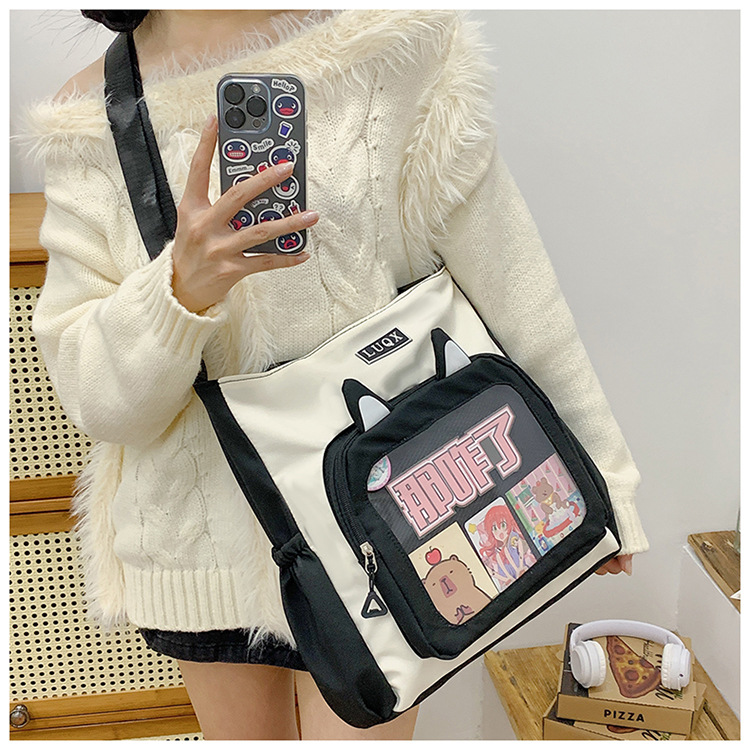 The new cute cartoon printed student bag with a large capacity and transparent student storage single-shoulder bag is selling well for women undefined
