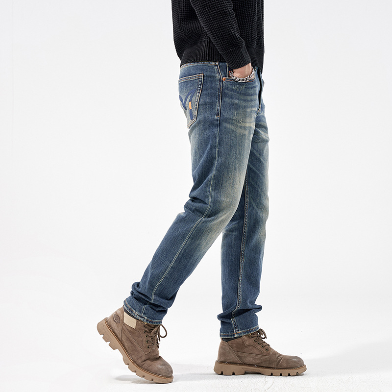 Comercio exterior moda moda juvenil nostálgica jeans lujoso ligero hombre cómodo delgado elástico pie pequeño jeans al por mayor