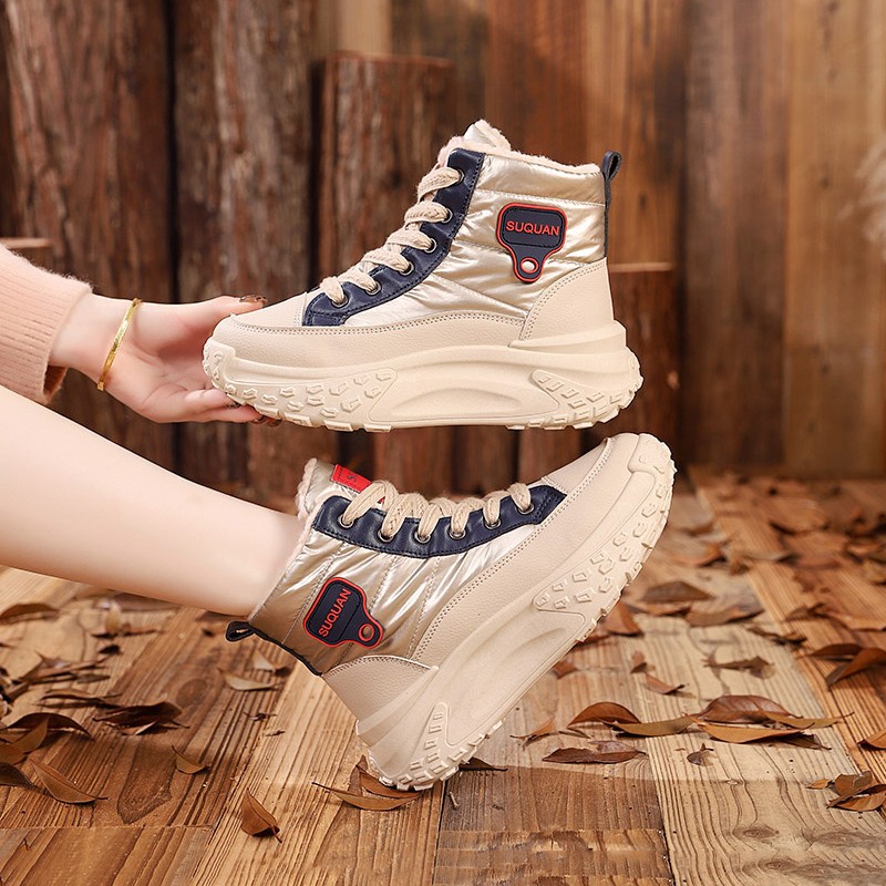 Botas de nieve de invierno de mujeres 2025, una nueva piel en una calentadora zapatillas deportivas cómodas y zapatos de algodón gruesos para mujeres