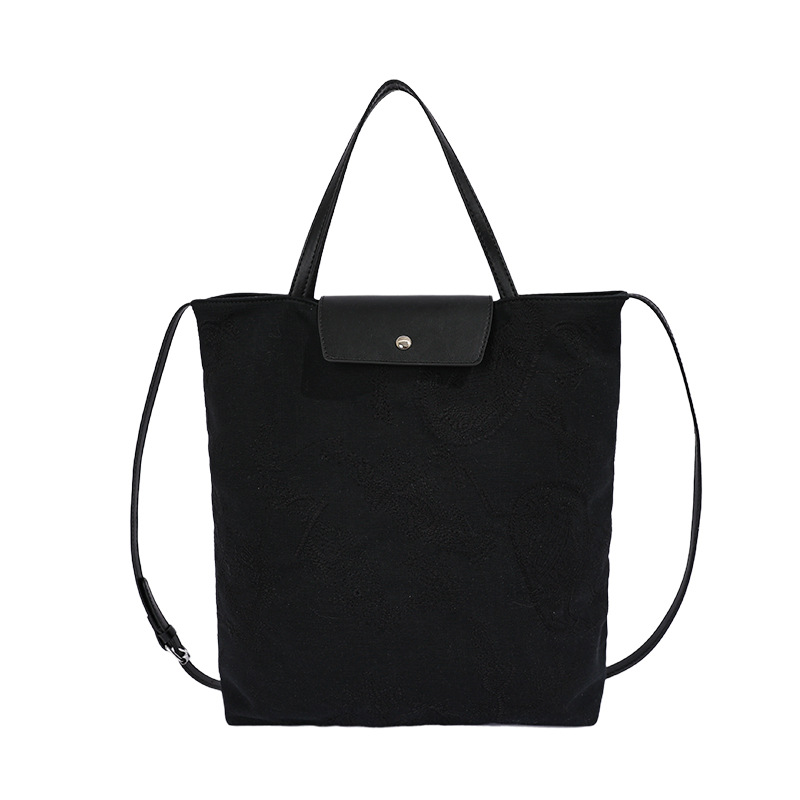 Bolso de mujer 2026 nuevo estilo coreano tela de gran capacidad bolso de mano de viaje simple diario mochila de hombro