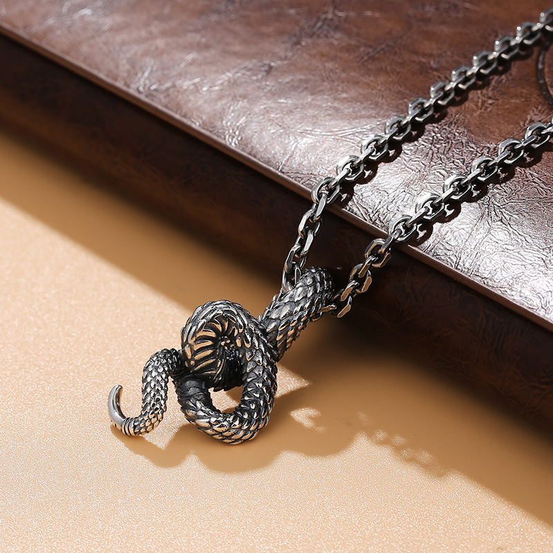 Side view of the coiled serpent pendant