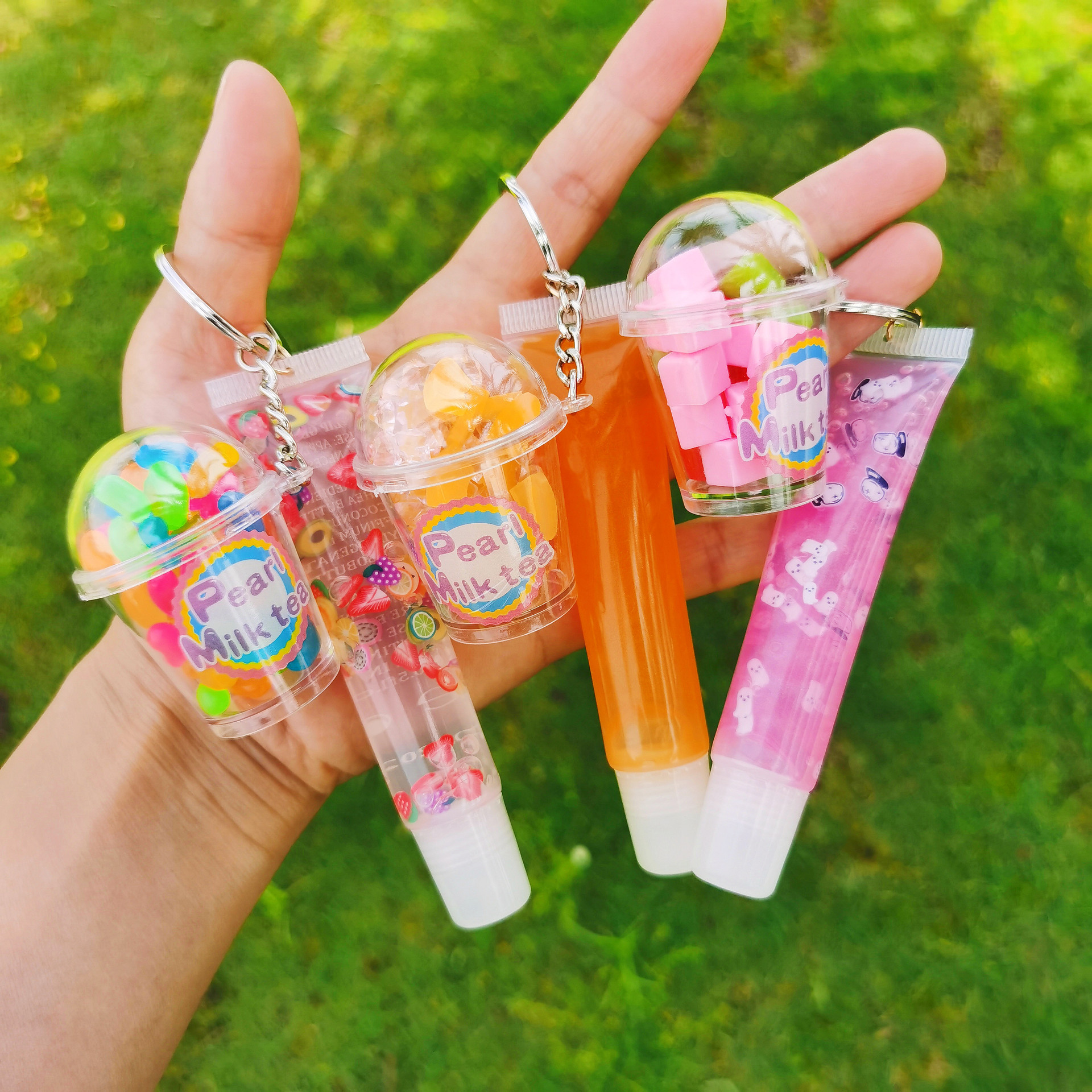 Shangxin niños cosméticos mecedora música llavero colgante tropical fruta niños piel bola colgante labio esmalte no lo