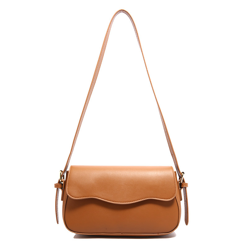 Bolsa de hombro de temperamento para mujeres 2024 otoño nuevo estilo de moda textura mochila de diseño artístico simple bolso de brazo