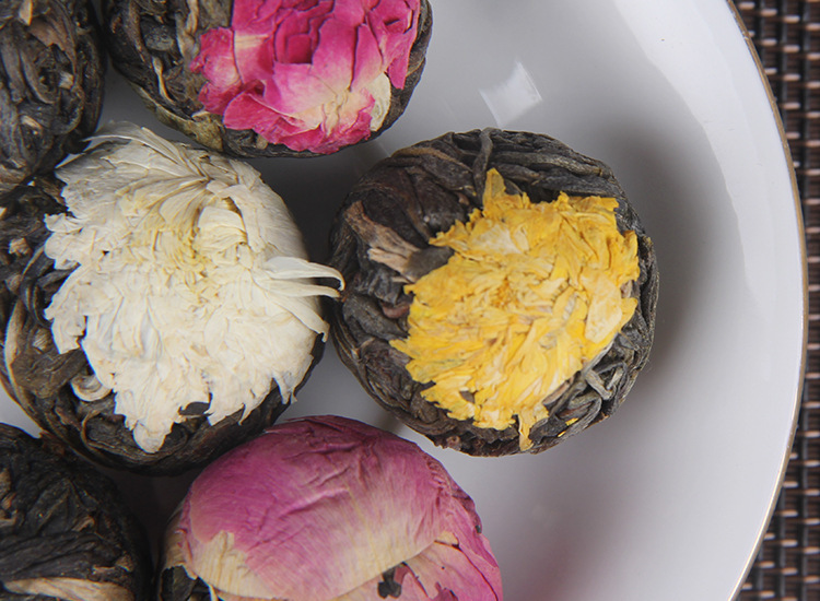 Yunnan Raw Pu-erh Flower Tea Dragon Balls Gift Box Six Floral Flavors 144g in use